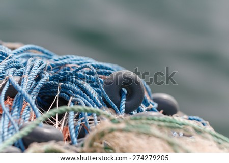 Fishing nets closeup. Background of fishing nets and floats. Fishing nets with sea background.
