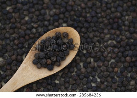 Black peppercorn background. Food background.