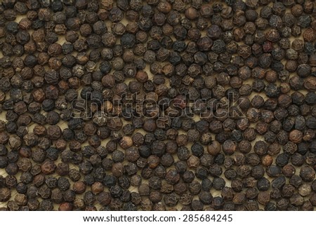 Black peppercorn background. Food background.
