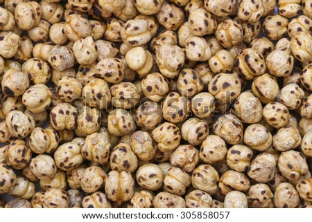 Roasted chickpea background. Roasted chickpea legume high protein snack texture.