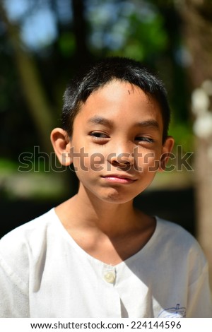 unhappy face Asian boy portrait
