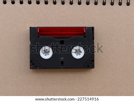 Red black Video tape in retro day beige background