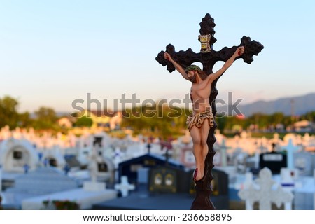 Jesus on Christ cross crucifixion  at graveyard