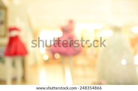 blur woman dress on window shopping background