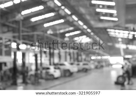 black and white blur car in factory background