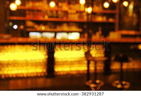 blur stools at counter in  bar and restaurant for hanging at dark night