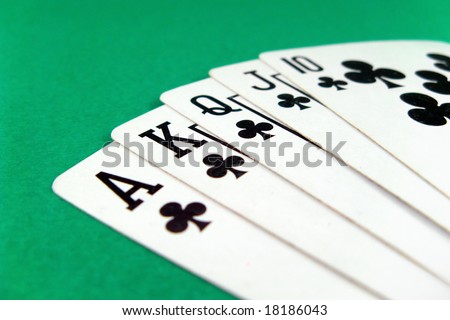 royal flash poker gamble cards on green casino table