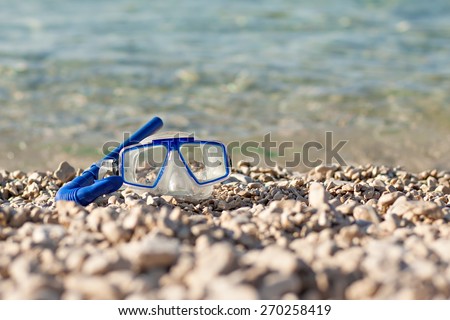 diving mask glasses and pipe at summer beach