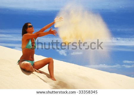 women throw up sand