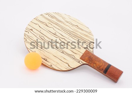Beautiful custom table tennis racket with ball on white background