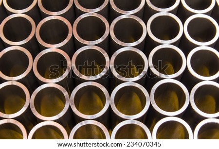 Stack of steel pipes automotive parts production industry