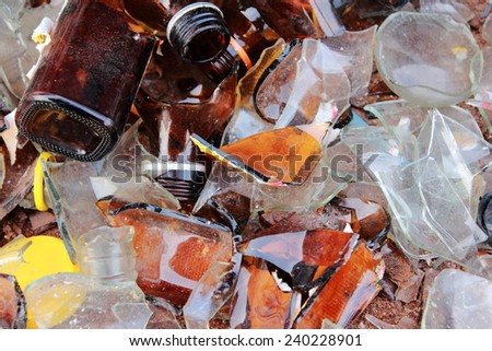 Shards of glass from the bottle on the ground