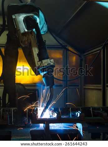 Industrial welder robotic in a car factory