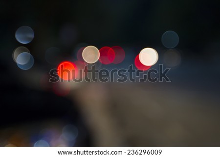 Light Bokeh on the road in the night time available for backgrounds texture
