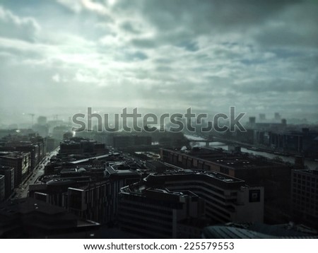 A grey sky forming mist over a grey city.