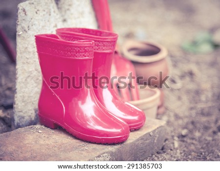 red color baby boots. garden boots for children , Vintage color tone