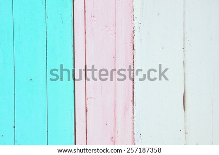 Blue, pink and white wooden background with vertical stripes. Vintage old backdrop. Pastel color. Vintage effect.