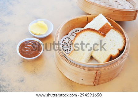 Steamed bread with Kaya and butter. Kaya toast. Traditional Singapore breakfast. Soft focus.
