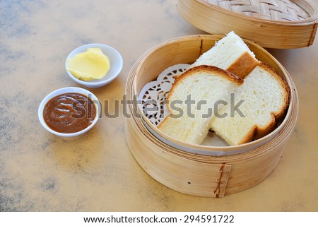 Steamed bread with Kaya and butter. Kaya toast. Traditional Singapore breakfast.