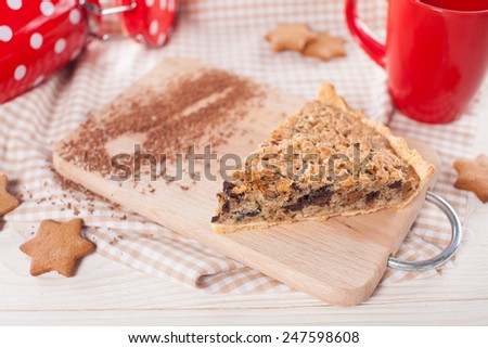 Slice of walnut cake with cookies