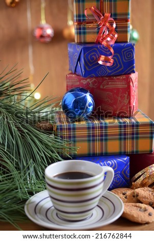 Christmas gifts, a cup of coffee and cookies