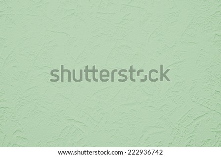 Wallpaper with light decorative texture for building repair decoration interiors. Mint green color. Minimalism style