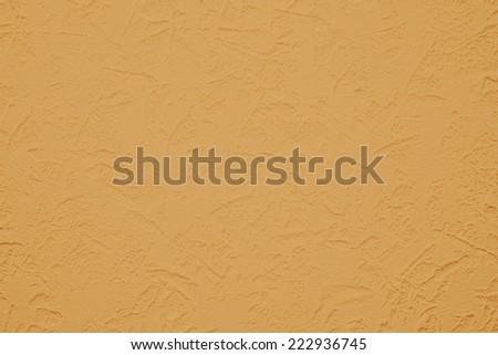 Wallpaper with light decorative texture for building repair decoration interiors. Orange ginger color. Minimalism style