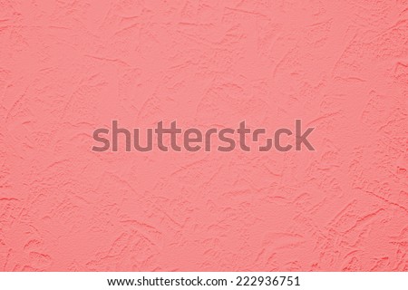 Wallpaper with light decorative texture for building repair decoration interiors. Pink coral color. Minimalism style