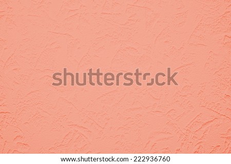 Wallpaper with light decorative texture for building repair decoration interiors. Coral orange color. Minimalism style