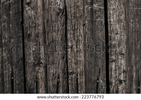 Grunge dark wooden background with old rough timber. Rustic style