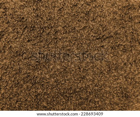 Warm wool colored cloth with sheep curled nap. Background useful new year cards and swatch for winter fashion collections