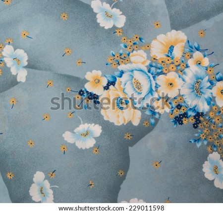 Chinese oriental silk cloth with floral pattern and big flowers. Grey blue and gold color