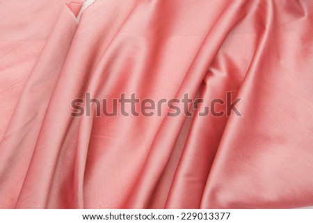 Deluxe silk cloth background with waves and drapery. Backdrop for fashion luxury design