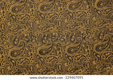 Indian floral pattern with cucumbers on a natural silk cloth. Background for oriental design style