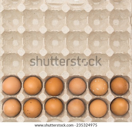 Eggs in a beige paper ecological cell container. Food packaging