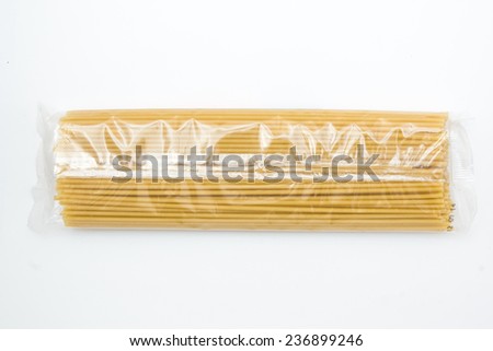 Pasta packed in a transparent food film isolated on white background