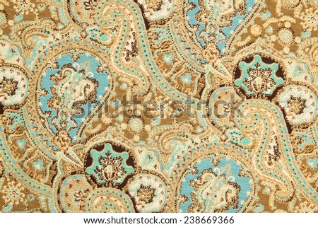 Oriental Indian cloth background with golden floral pattern