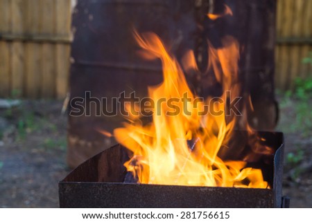 Fire with flames in a metal brazier for kebab