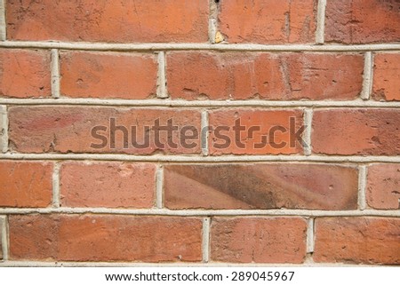 background with old rough antique brick wall terracotta brick with cracks and splits