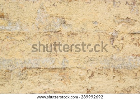 Grunge white background with cracks and grain.  Brick wall with the whitewash falling off fragment as a background texture