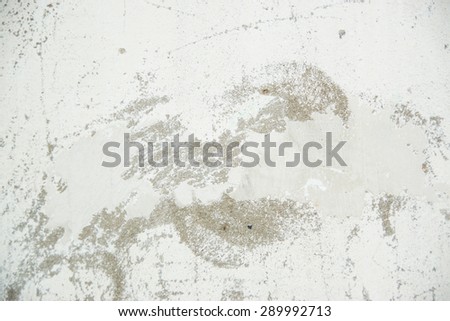 Grunge white background with cracks and grain.  Brick wall with the whitewash falling off fragment as a background texture