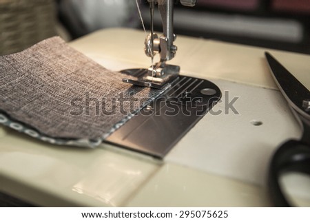 Patchwork sewing technology. Linking pastel cloth patches with sewing machine. A reverse side of a work.