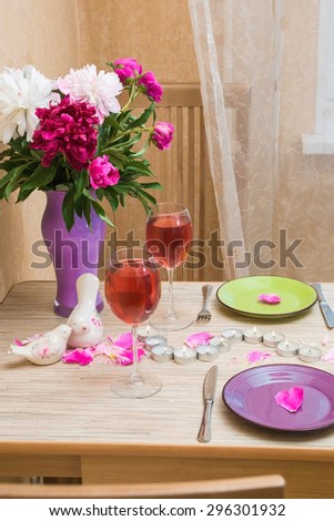 Romantic atmosphere for dinner at home with served and decorated table