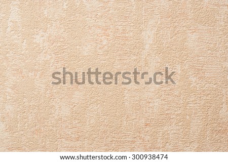 Wallpaper with light decorative texture for building repair decoration interiors. Beige pastel color. Minimalism style