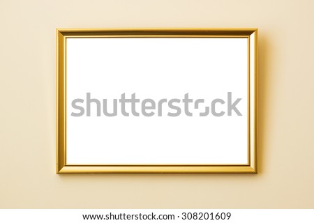 Classical simple golden frame on a beige wall with drop shadow