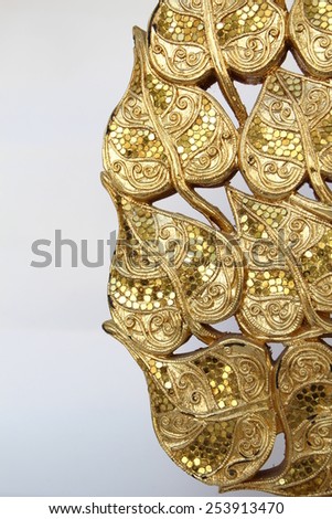 Wood carvings, gold color, white background.
