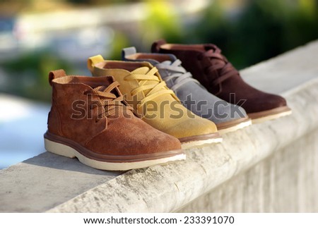 Men's high-top leather shoes on a Outdoor background