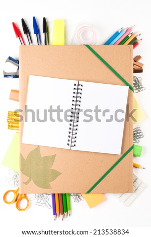 School equipment with notebook on white background
