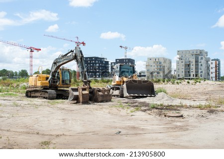 Construction urban building in city with bulldozer