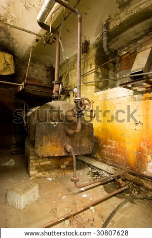 Old boiler and rusted wall.
